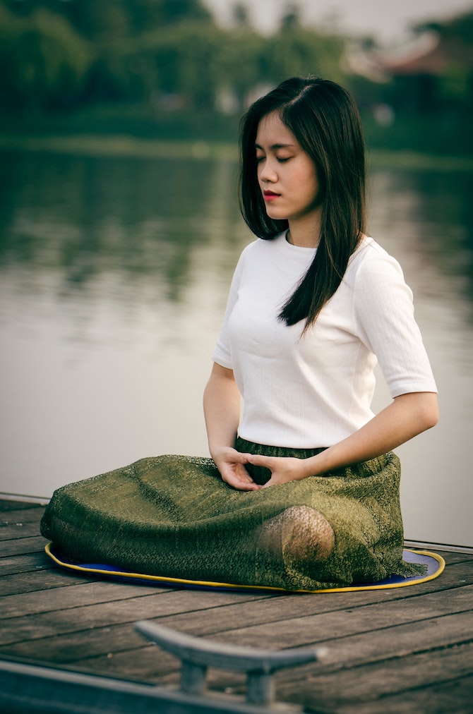 Asian woman meditating