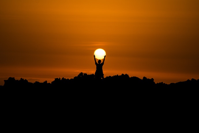 Person holding the sun