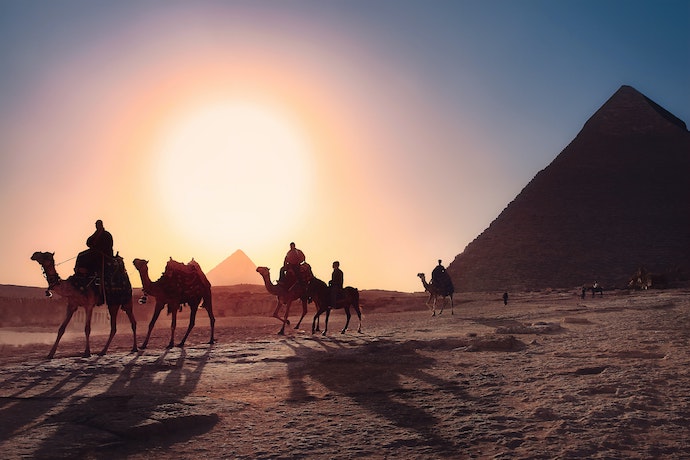Pyramids, camels, and a sunset