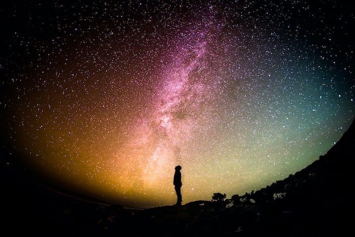 Man standing in front of the milky way