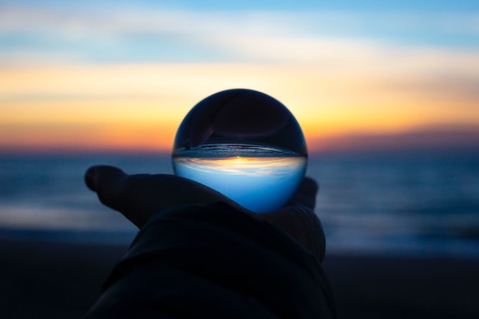 Looking through a glass ball into the sunset