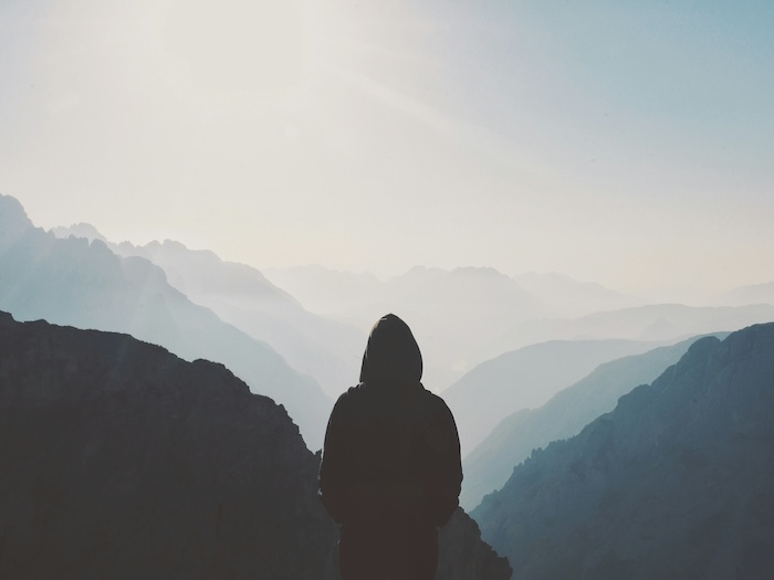 Person on a mountain looking at the horizon