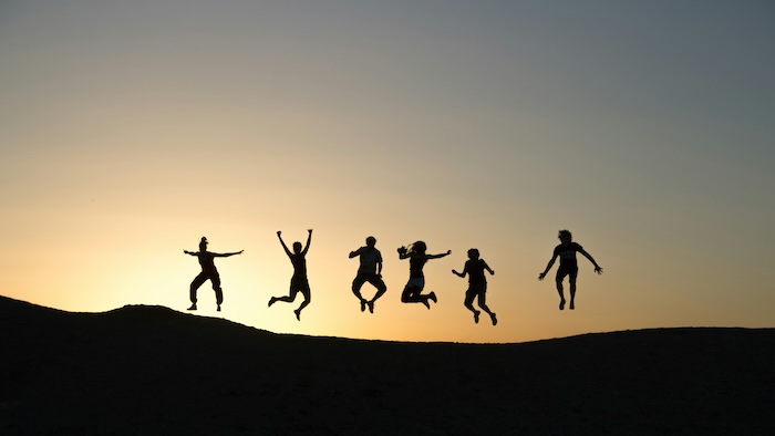 People jumping in the sunset